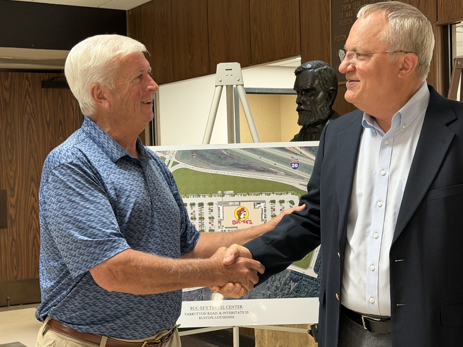 Bruce Siegmund and Mayor Ronny Walker with the site plan for the new Buc-ee's Travel Center at Tarbutton Road and Interstate 20 in Ruston